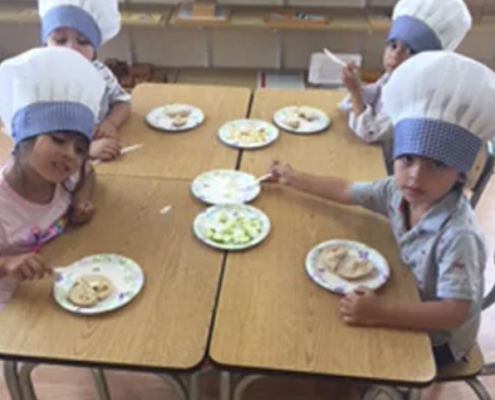 a child independently choosing a Montessori work activity in a prepared environment