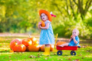 a child developing responsibility while cleaning up the Montessori classroom